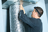 man doing duct cleaning