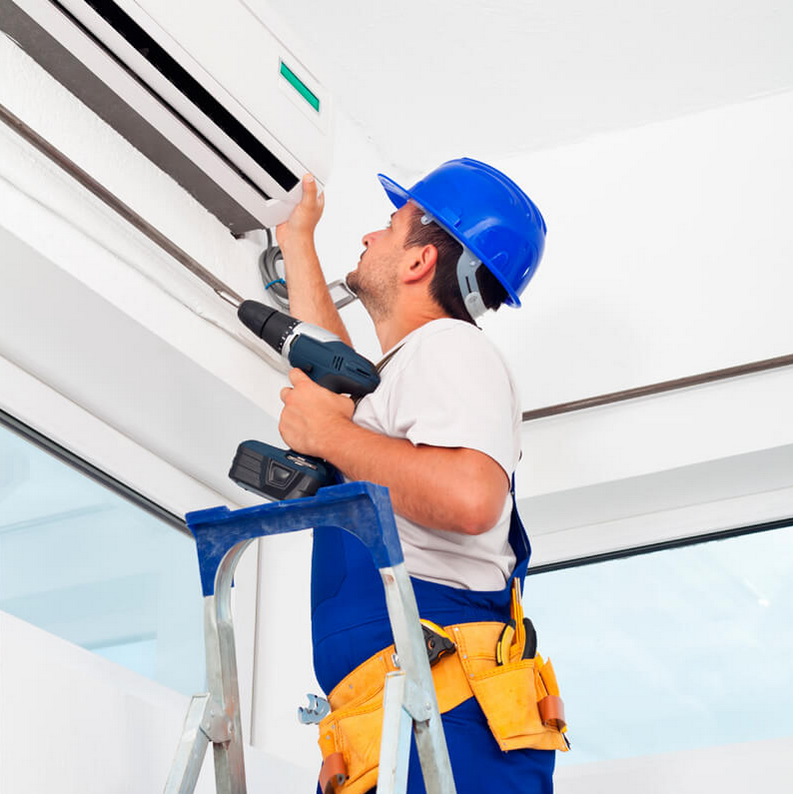 man cleaning AC